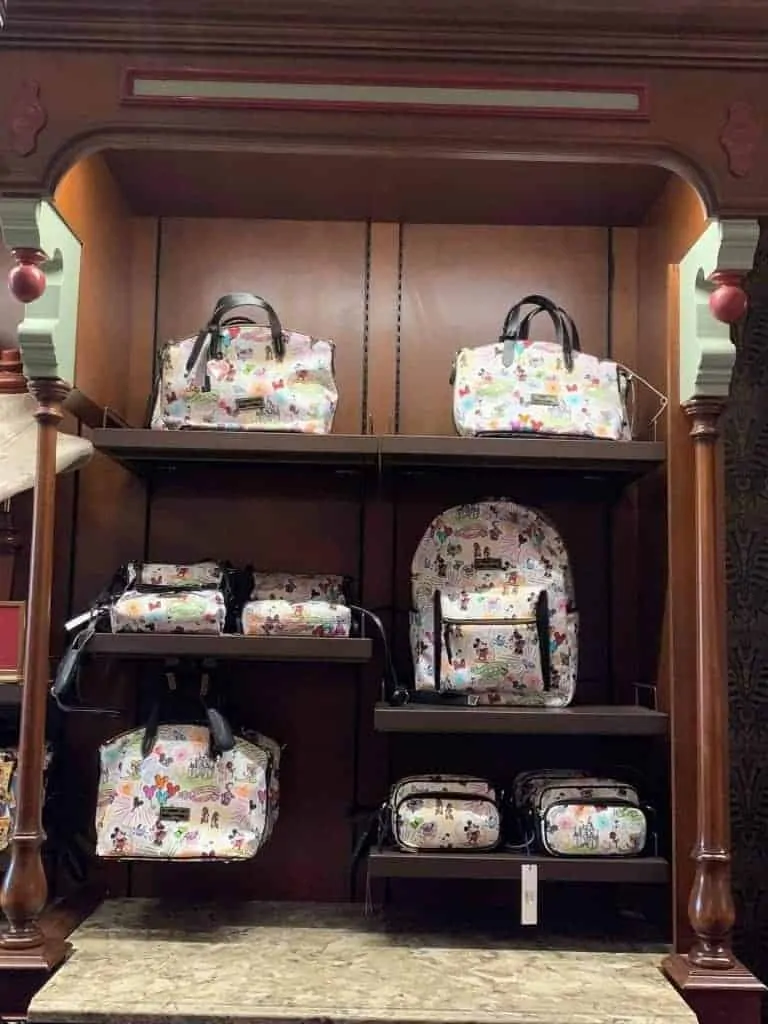 Disney Dooney and Bourke Sketch Collection at Uptown Jewelers in Magic Kingdom