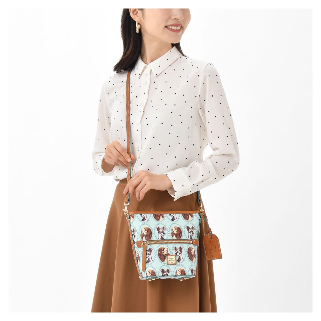 Lady and the Tramp Crossbody with model by Dooney & Bourke