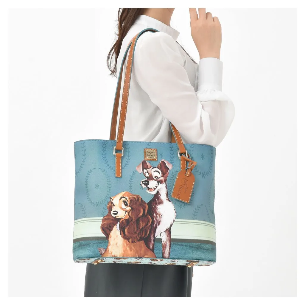 Lady and the Tramp Tote with model by Dooney & Bourke 