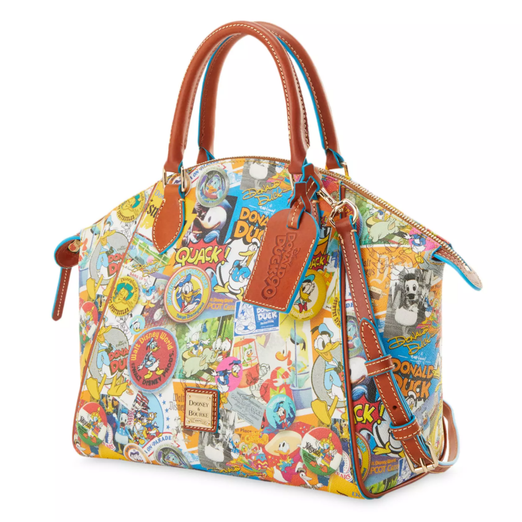 Donald Duck Dooney & Bourke Satchel Bag – 90th Anniversary (side) Donald Duck Dooney & Bourke Satchel Bag – 90th Anniversary (side)