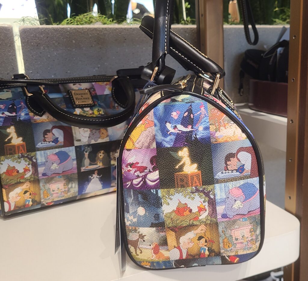 Disney Classic Films Barrel Satchel (side) by Disney Dooney and Bourke Disney Classic Films Barrel Satchel (side) by Disney Dooney and Bourke