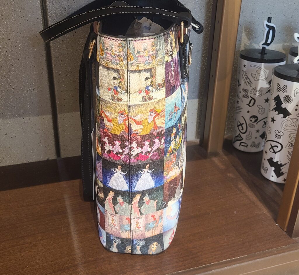Disney Classic Films Tote Bag (side) by Disney Dooney and Bourke Disney Classic Films Tote Bag (side) by Disney Dooney and Bourke