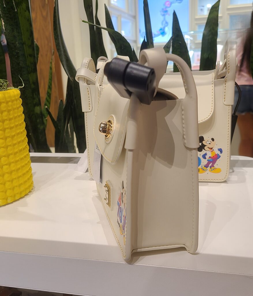 Disneyland 70th Anniversary Crossbody Bag (side) by Disney Dooney & Bourke Disneyland 70th Anniversary Crossbody Bag (side) by Disney Dooney & Bourke