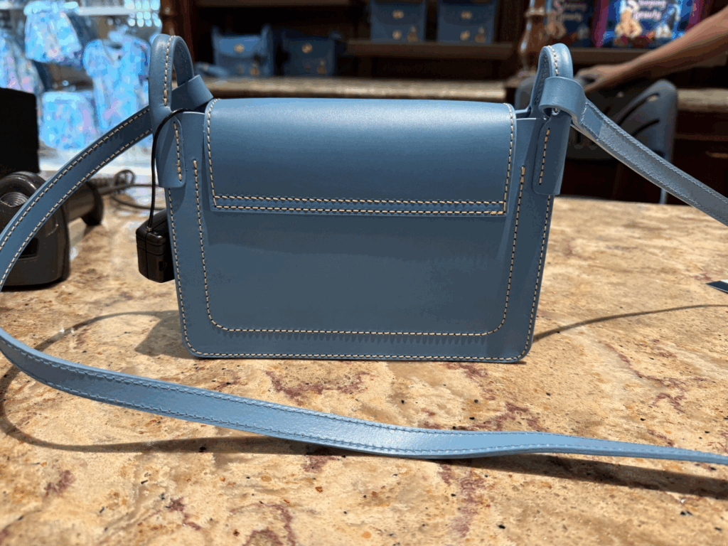 Mickey Mouse Blue Pinky Leather Crossbody Bag by Disney Dooney & Bourke (back) Mickey Mouse Blue Pinky Leather Crossbody Bag by Disney Dooney & Bourke (back)