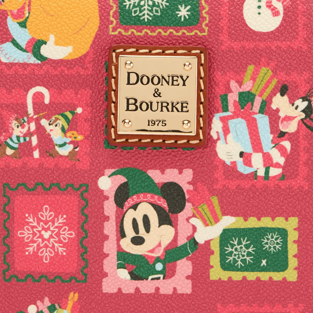 Mickey Mouse Family Christmas Dooney & Bourke Crossbody Bag – Exclusive (close up of label) Mickey Mouse Family Christmas Dooney & Bourke Crossbody Bag – Exclusive (close up of label)