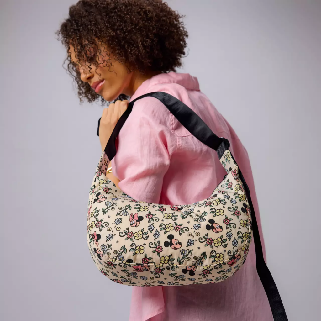 Mickey and Minnie Mouse Floral Crescent Bag by Baggu (model) Mickey and Minnie Mouse Floral Crescent Bag by Baggu (model)