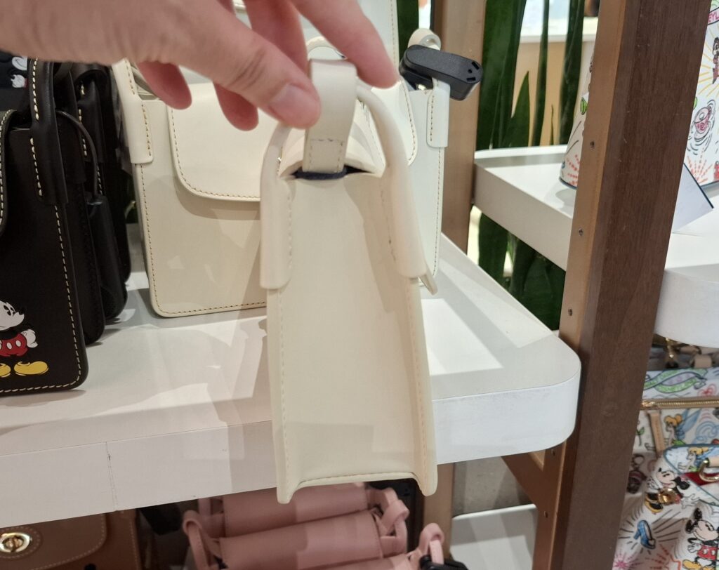 Mickey White Pinky Crossbody Bag by Disney Dooney & Bourke (side) Mickey White Pinky Crossbody Bag by Disney Dooney & Bourke (side)