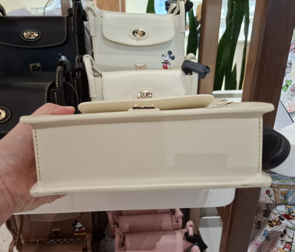 Mickey White Pinky Crossbody Bag by Disney Dooney & Bourke (bottom) Mickey White Pinky Crossbody Bag by Disney Dooney & Bourke (bottom)